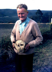 Mr W.F. [Bill] Gilroy holding Skull